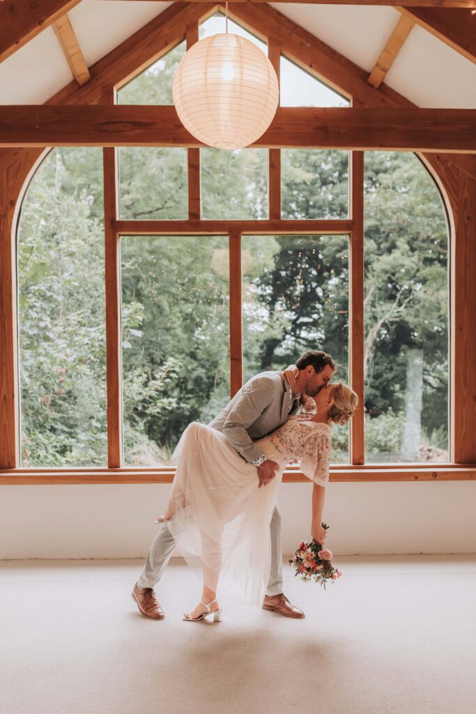 groom dipping bride at nantwen elopement