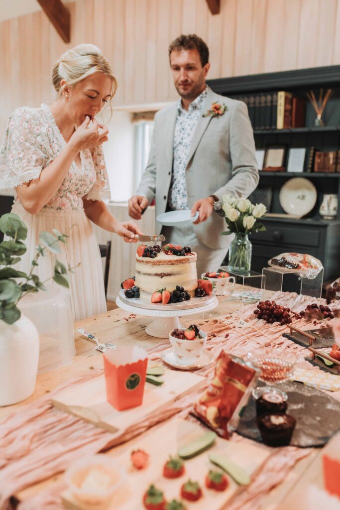bride and groom eating wedding cake