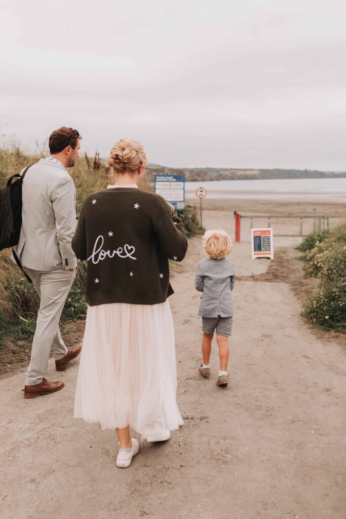 family arriving at the beach on countryside elopement
