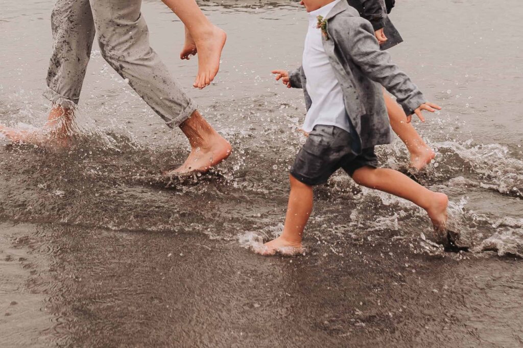 feet splashing in the shallows at countryside elopement