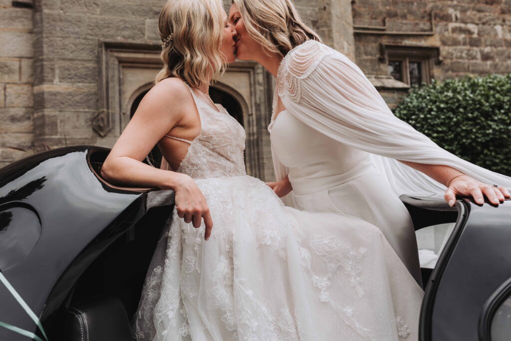brides kissing in batmobile