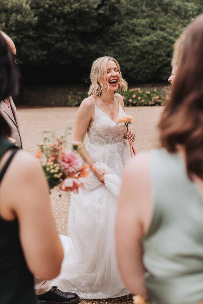 bride laughing at wadhurst castle wedding