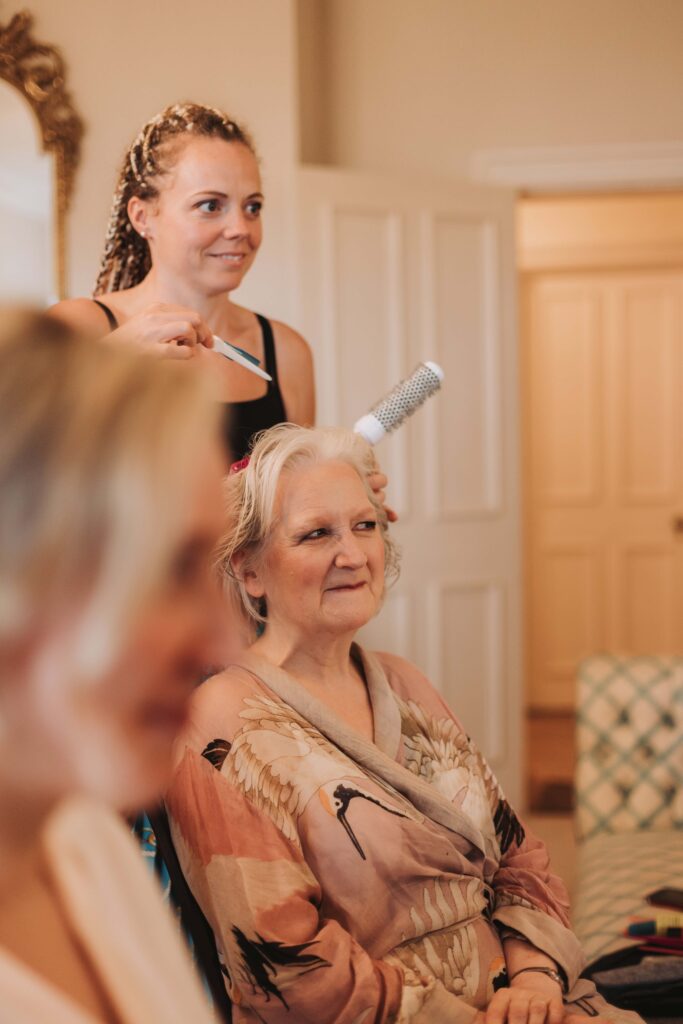 mother of the bride having her hair done