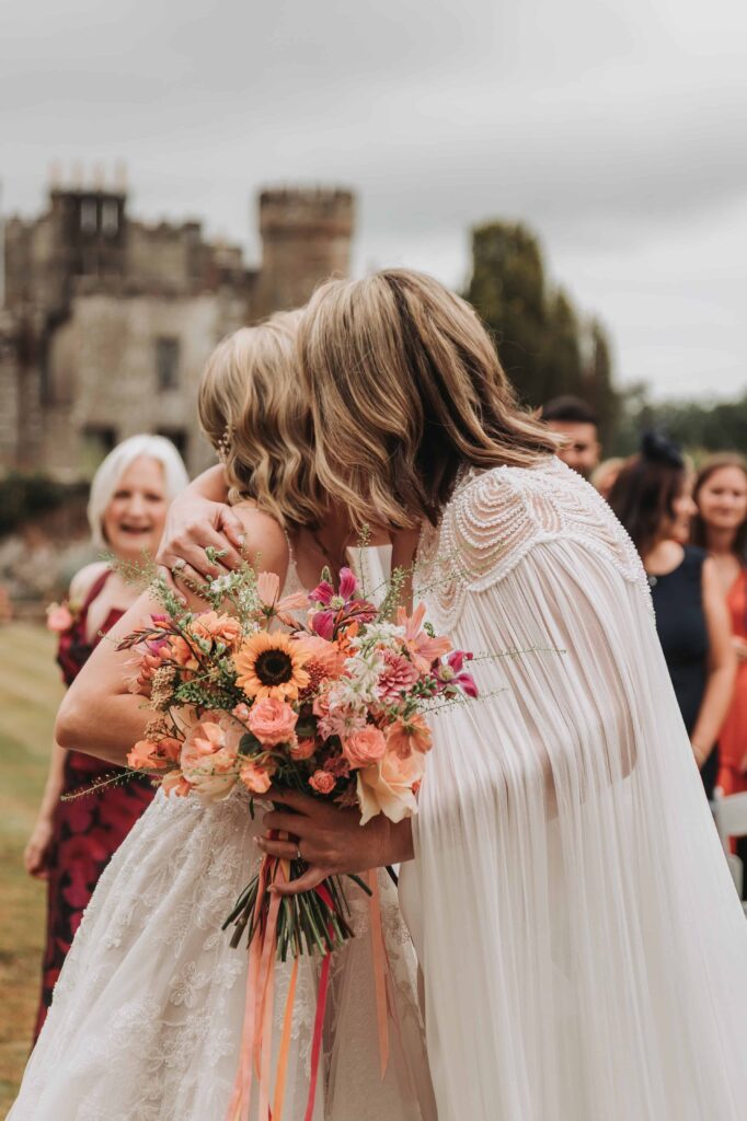 brides seeing each other for the first time at the end of the aisle