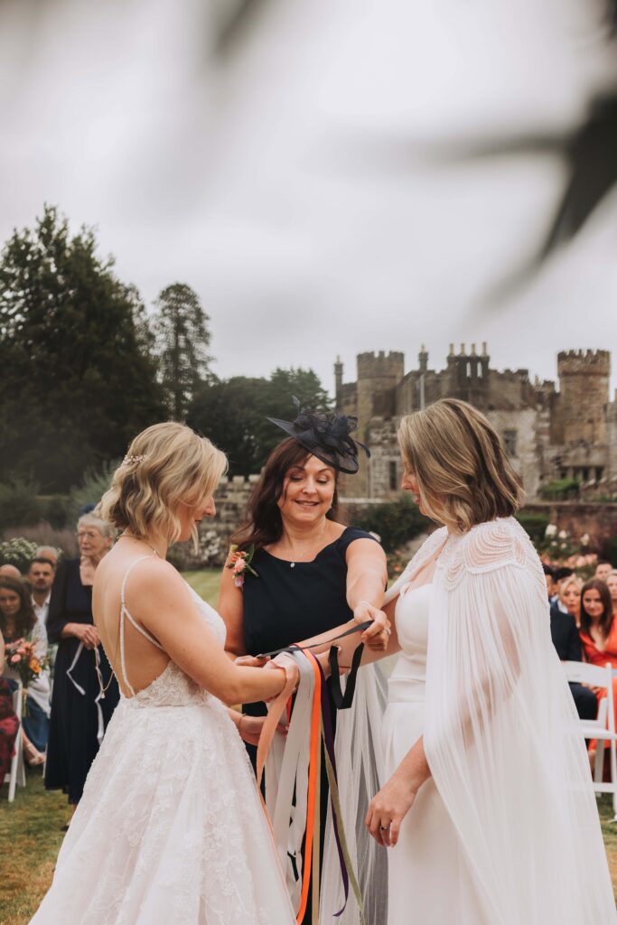 hand fasting at lgbtq wedding ceremony