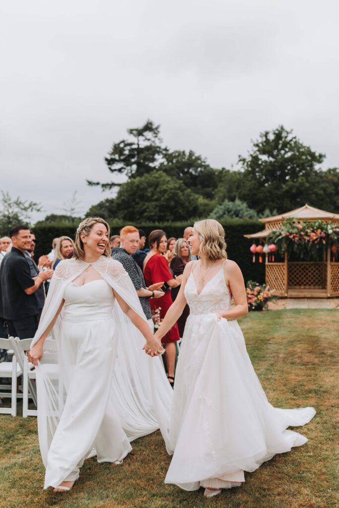 brides walking back down the aisle officially married