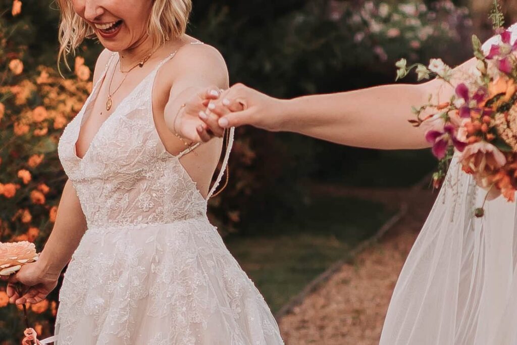 close up of brides holding hands