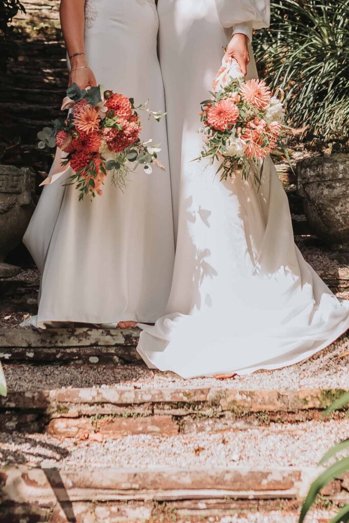 two brides holding bouquets