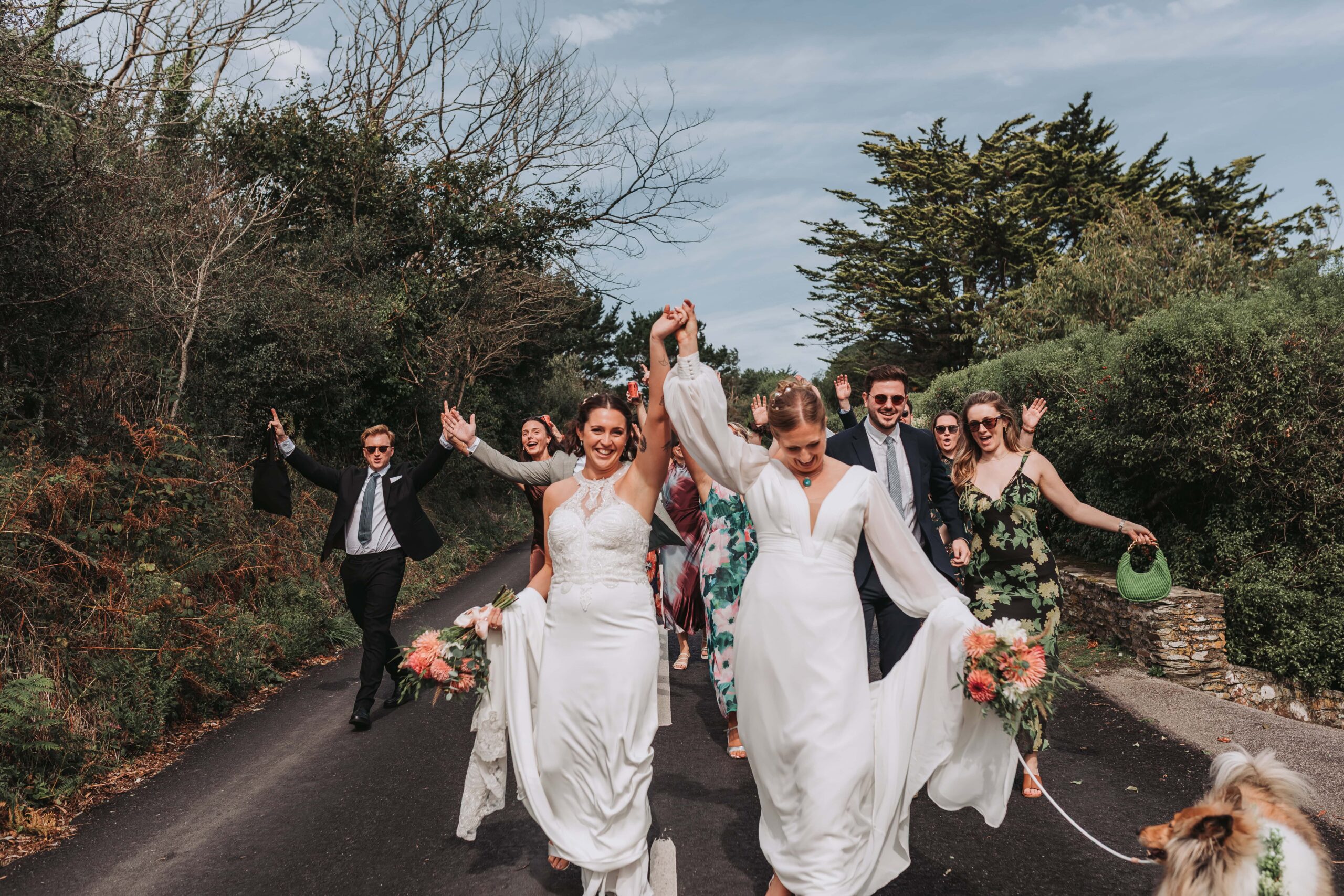 mass guest walk down the road in st mawes at cornwall lgbtq+ wedding
