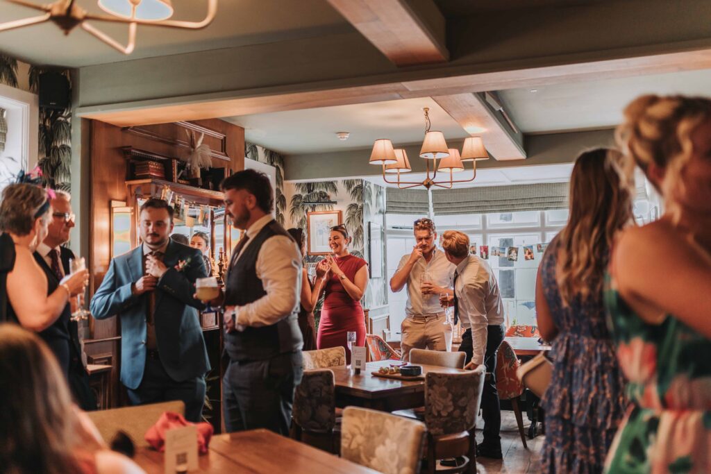guests eating canapes in the rising sun