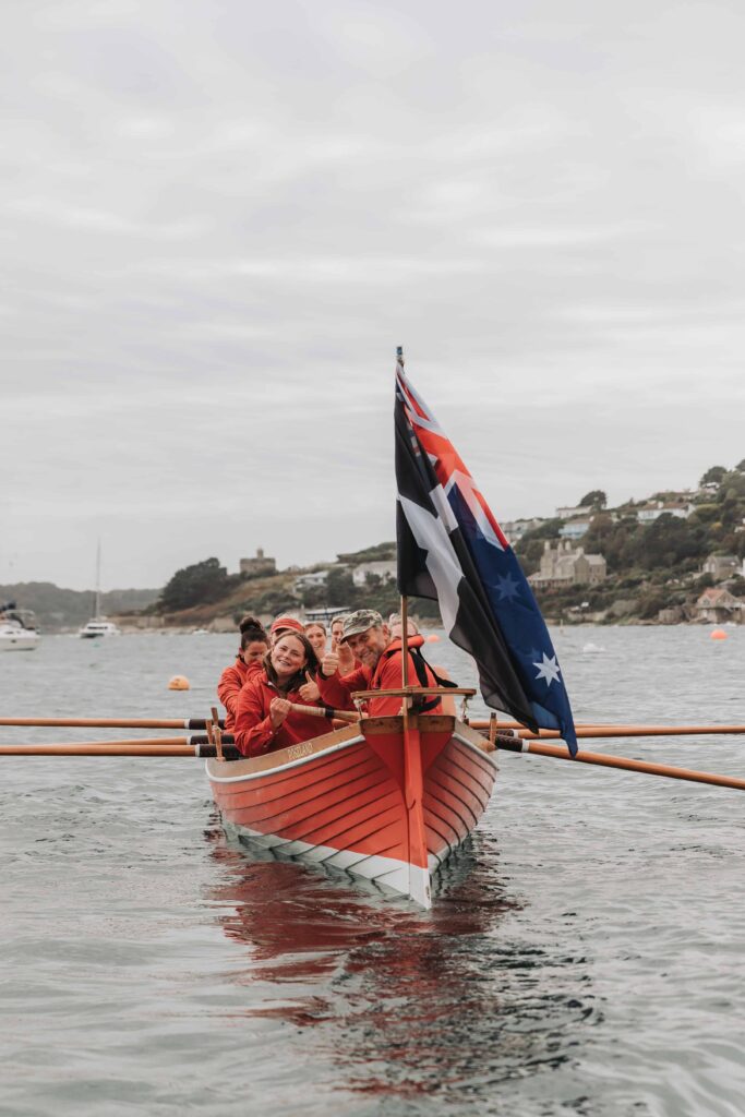 gig rowers rowing two brides in st mawes