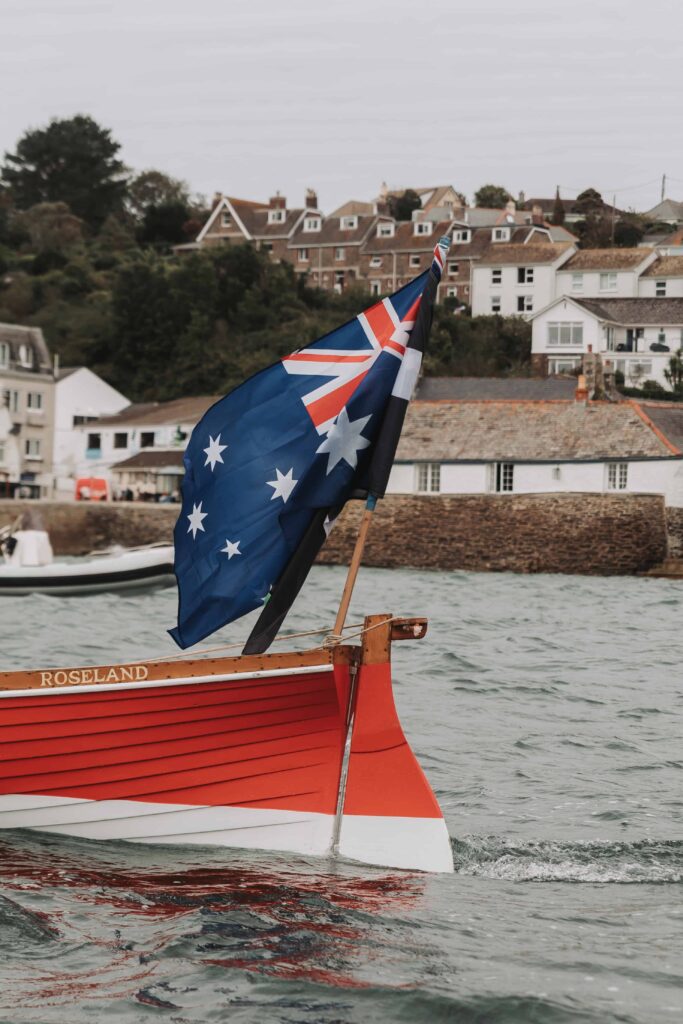 cornish and new zealand flag on gig