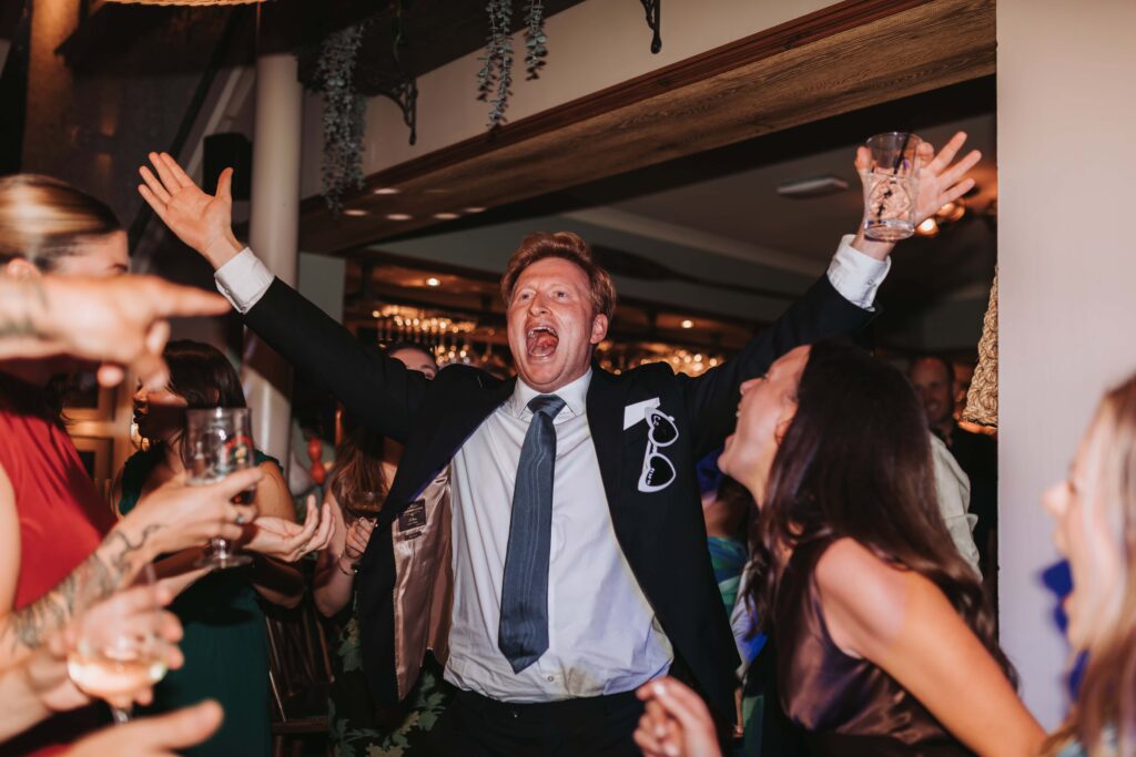 guests singing at cornwall lgbtq+ wedding