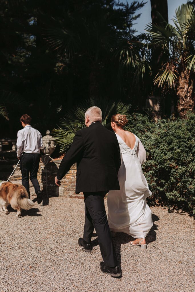 bride walking to ceremony at lamorran gardens