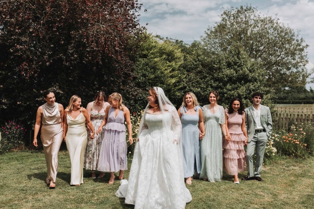 bride and bridal party walking in a line