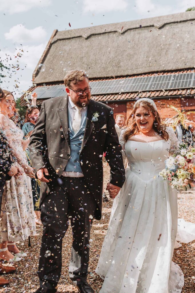 confetti tunnel at norfolk garden wedding
