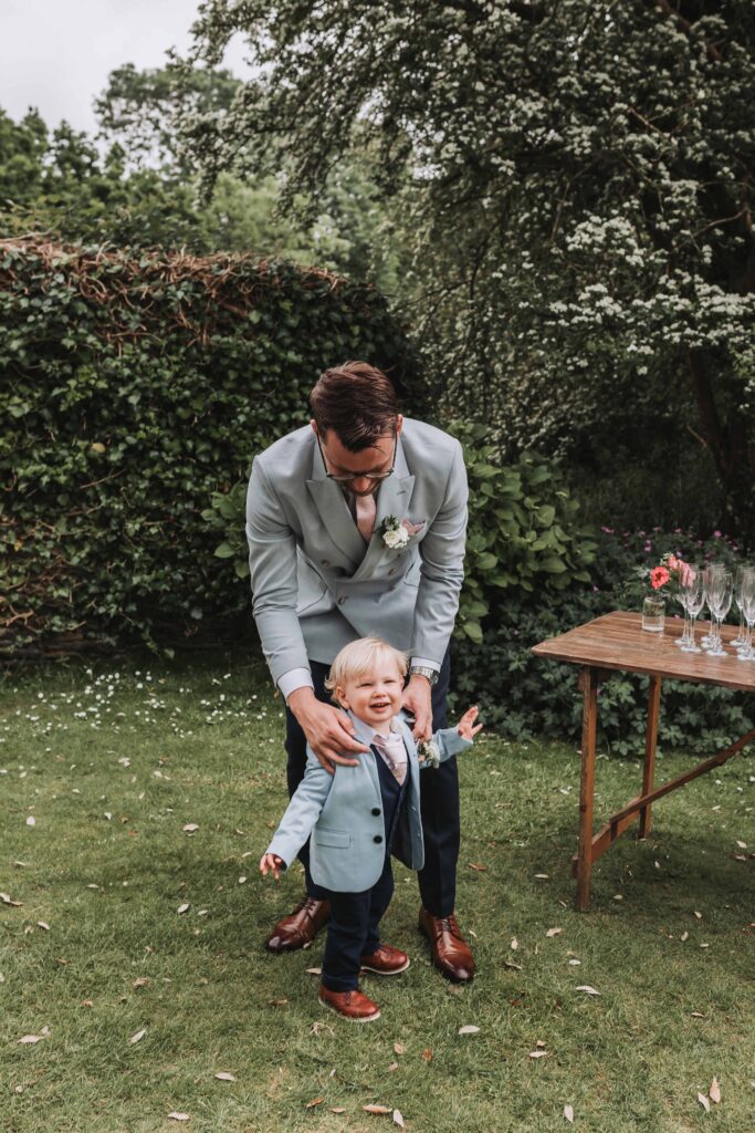 groom and son at cornwall wedding