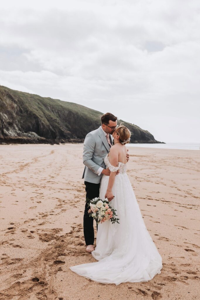 bride and groom on cornish beach
