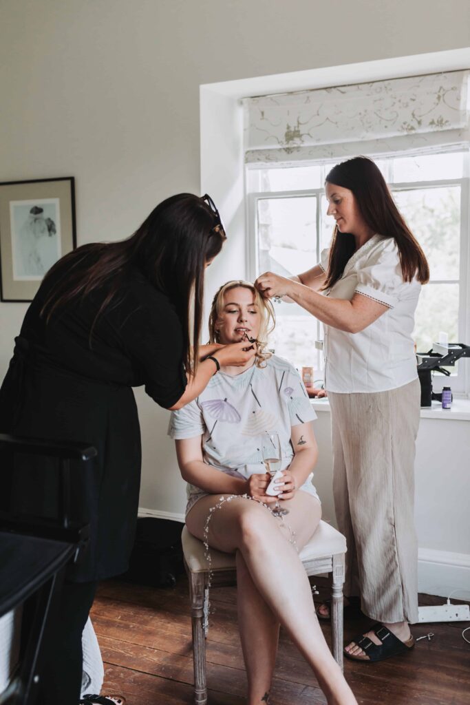 bride having hair and make up done at treseren wedding