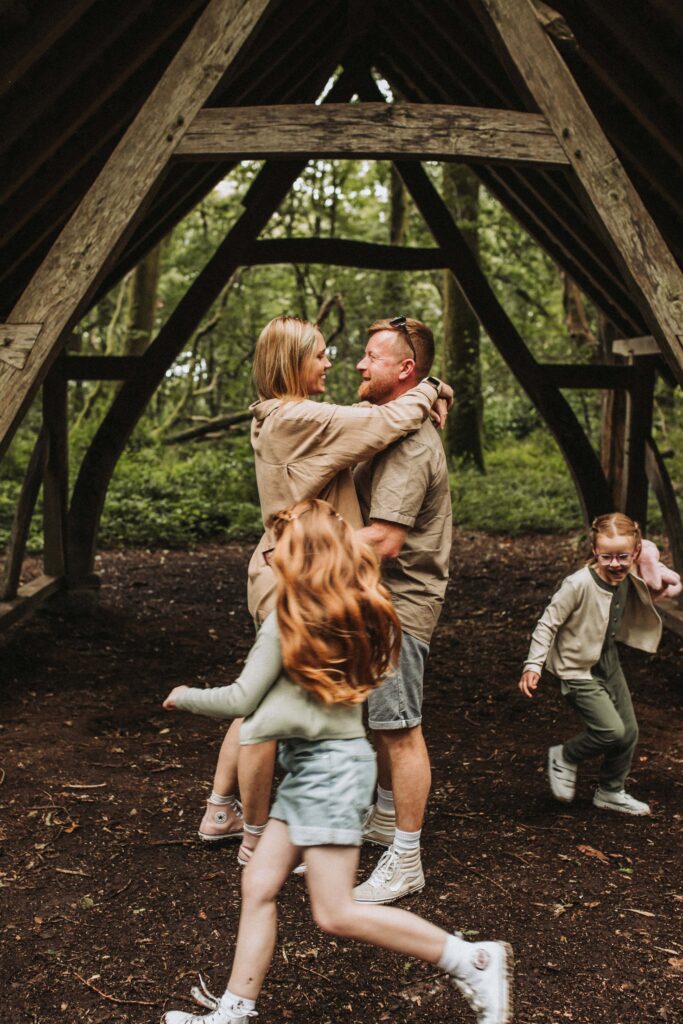 kids running around parents at family photoshoot