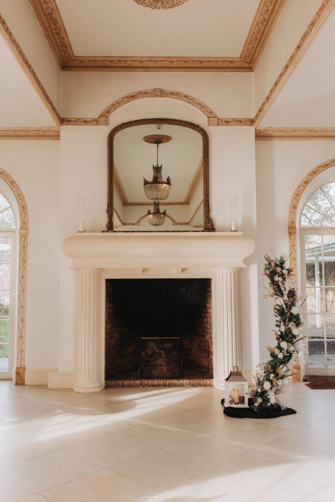 ceremony room at northbrook park wedding with flower crescent display