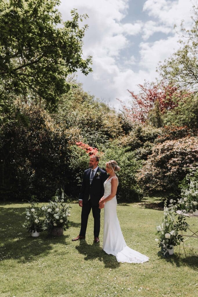bride and groom during ceremony on treseren front lawn