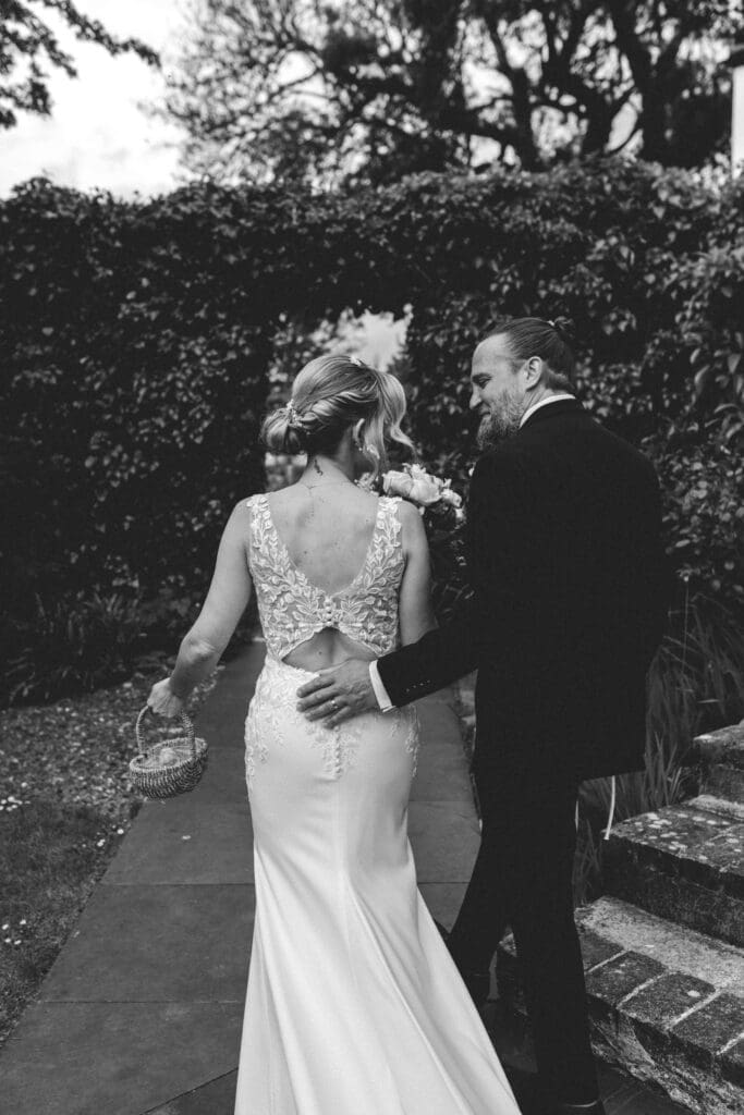 bride and groom walking at cornwall elopement wedding