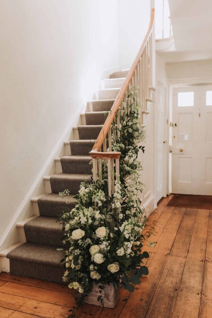 floral decorated staircase at treseren
