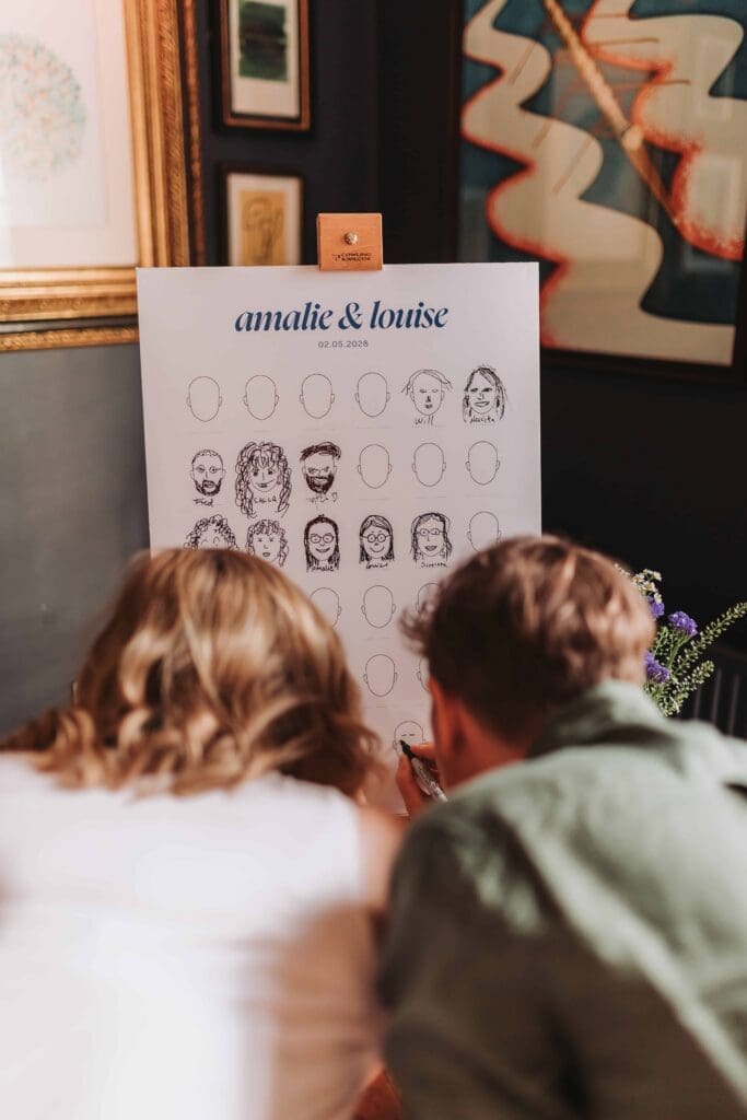 guests drawing faces at wandsworth town hall wedding