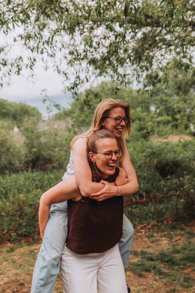 bride giving their wife a piggyback