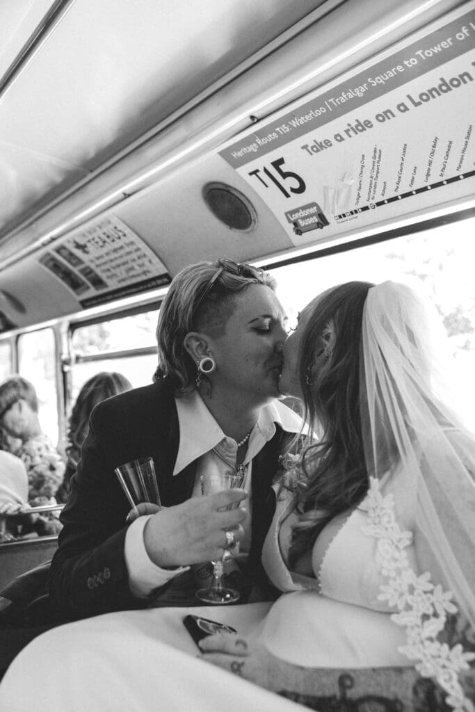 brides kissing inside london double decker bus