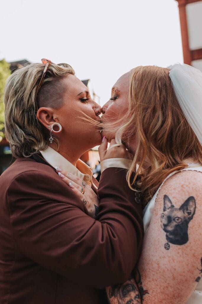 two brides kissing each other