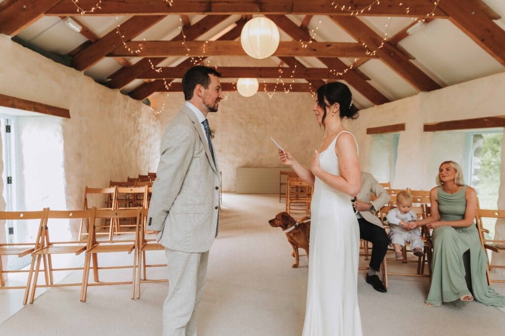 bride and groom sharing private vows after deciding to elope in the uk