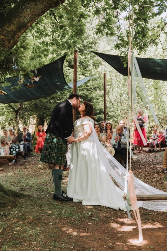 first kiss at woodland wedding