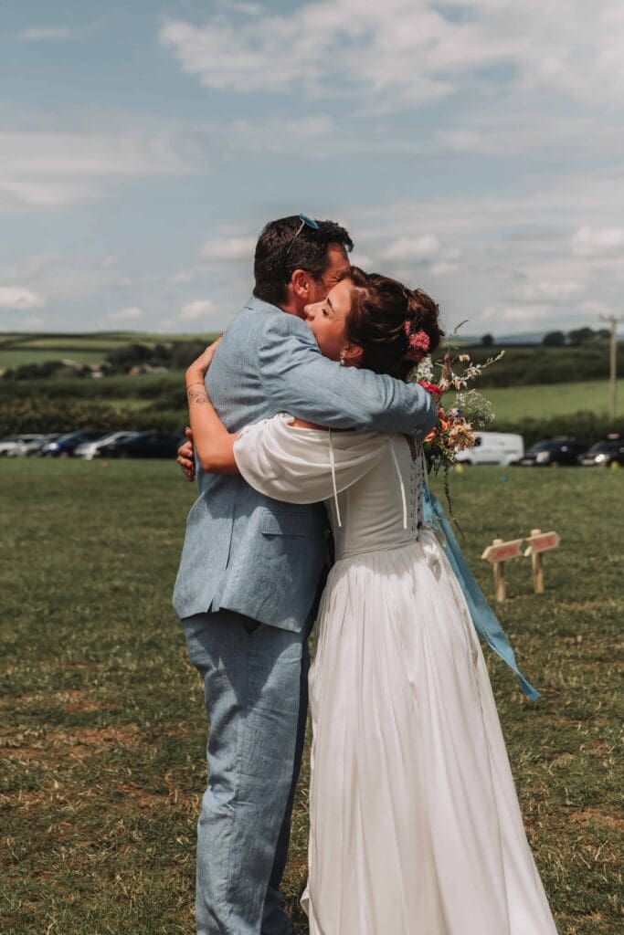 bride hugging dad