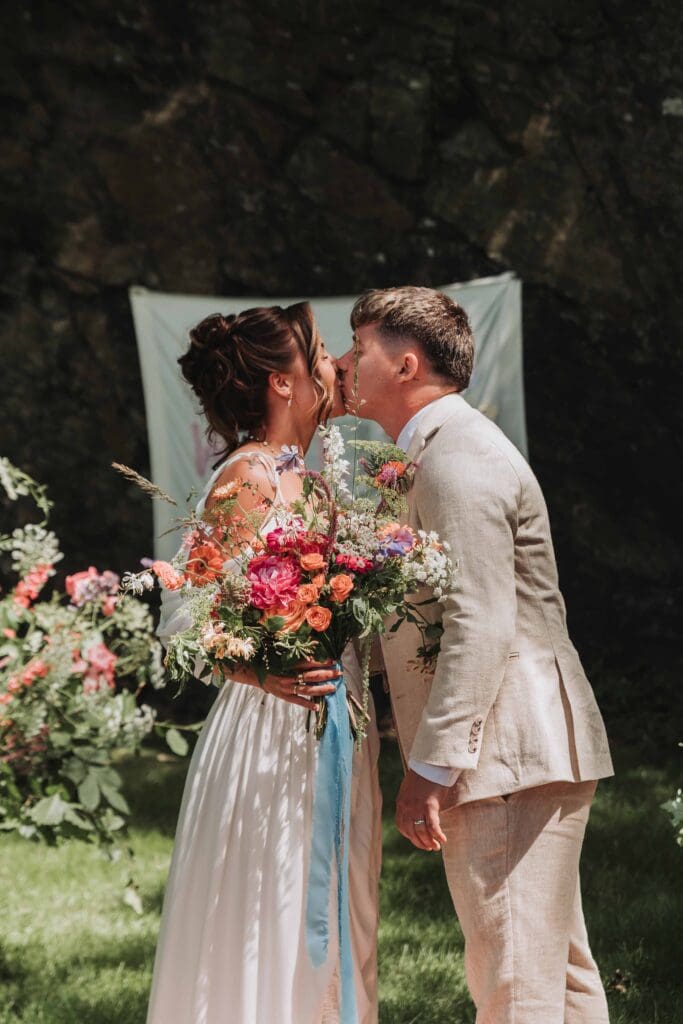 first kiss at festival wedding