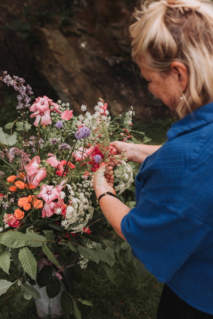 florist setting up wedding flowers
